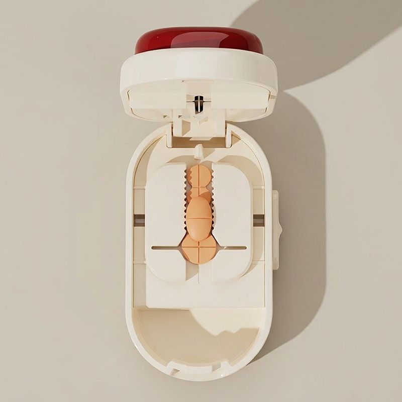 Coupe-comprimés et étui de rangement 2 en 1